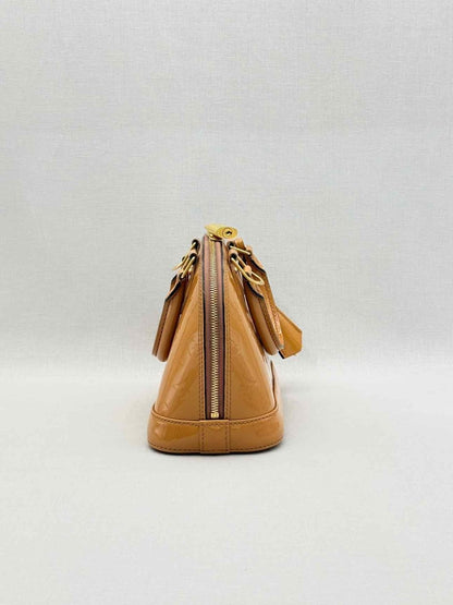 Pre-loved LOUIS VUITTON Alma Tan Monogram Top Handle at Reems Closet