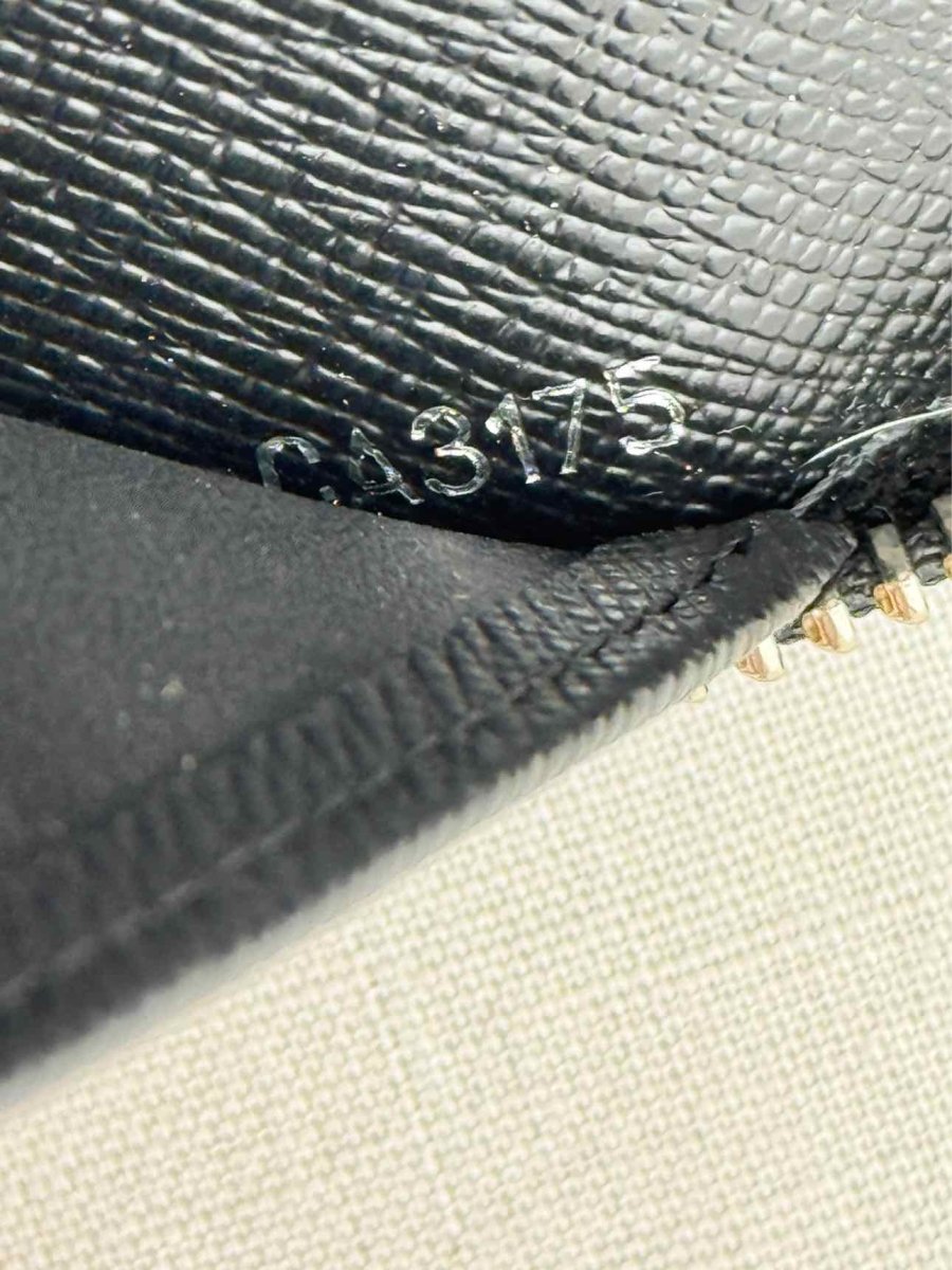 Pre - loved LOUIS VUITTON Black Continental Wallet at Reems Closet