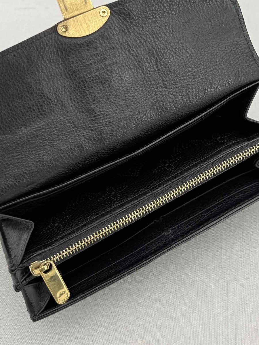 Pre - loved LOUIS VUITTON Black Monogram Continental Wallet at Reems Closet
