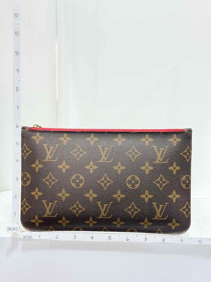 Pre - loved LOUIS VUITTON Brown Monogram Pouch at Reems Closet