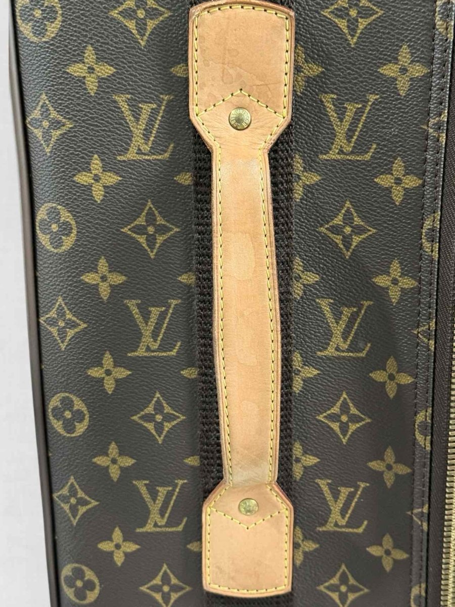 Pre - loved LOUIS VUITTON Brown Monogram Rolling Luggage at Reems Closet