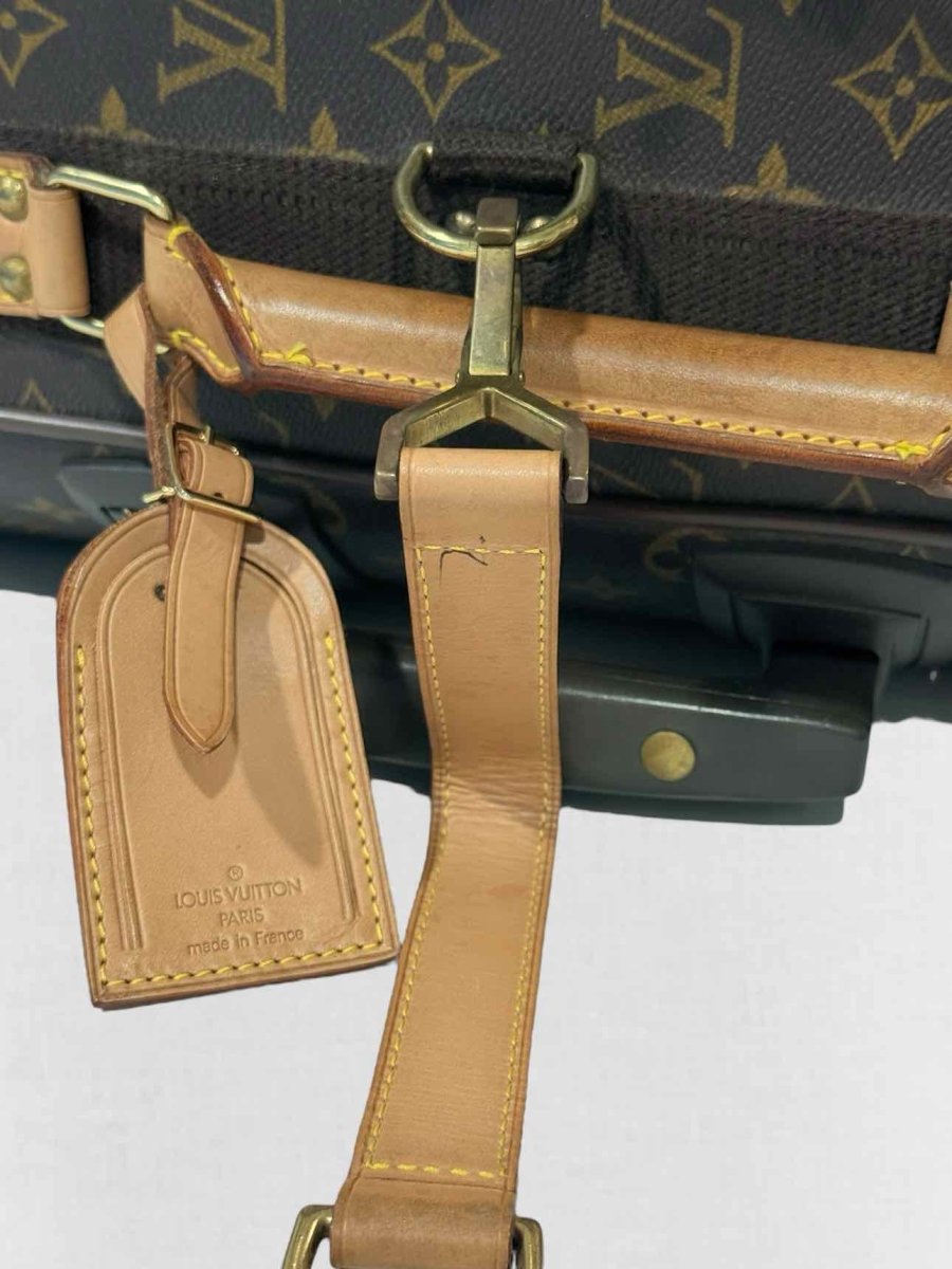 Pre - loved LOUIS VUITTON Brown Monogram Rolling Luggage at Reems Closet