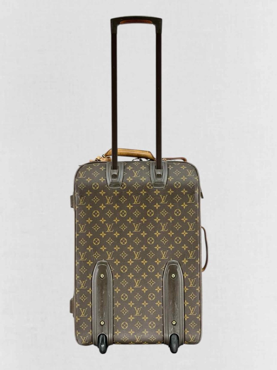 Pre - loved LOUIS VUITTON Brown Monogram Rolling Luggage at Reems Closet