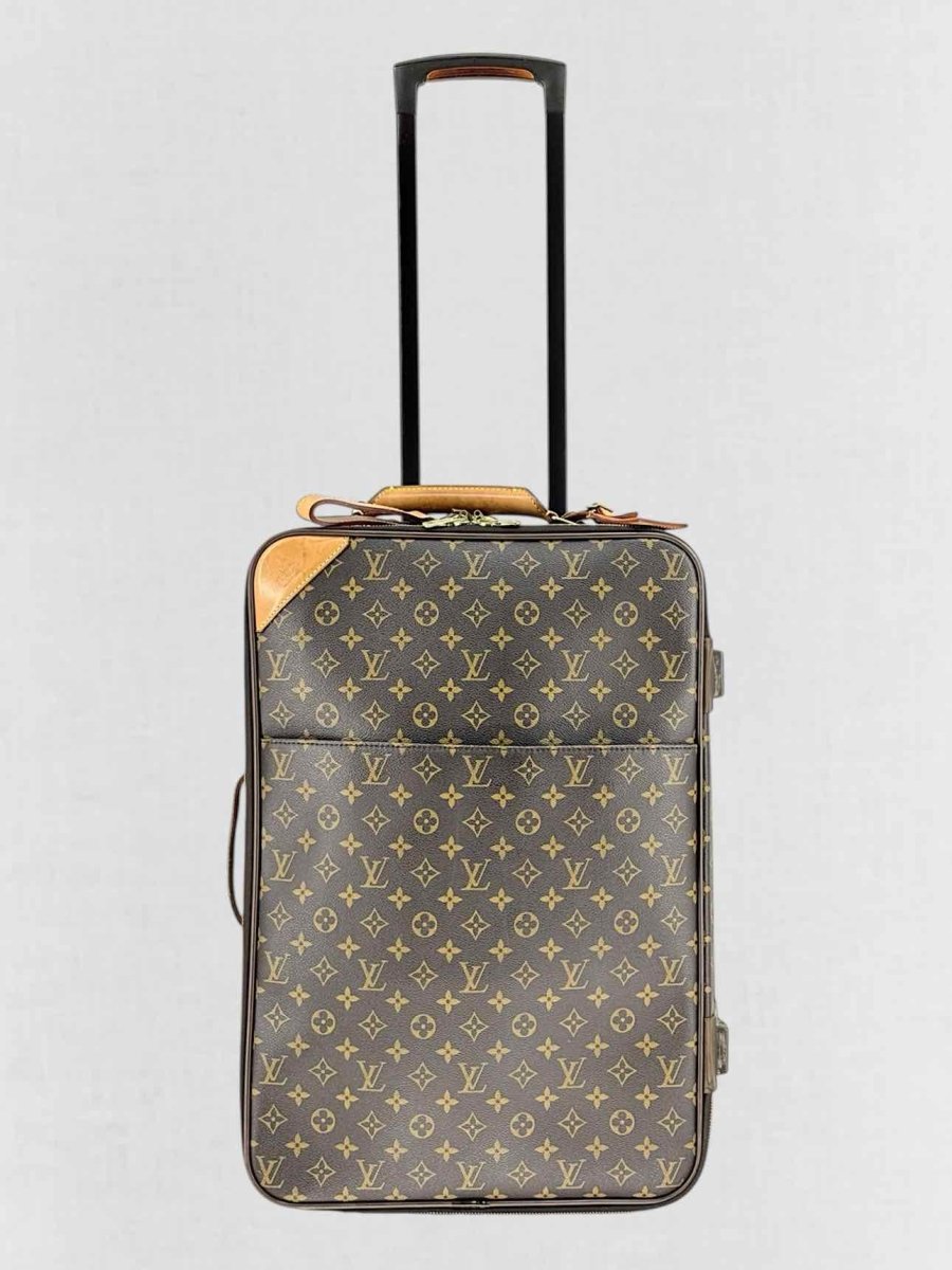 Pre - loved LOUIS VUITTON Brown Monogram Rolling Luggage at Reems Closet
