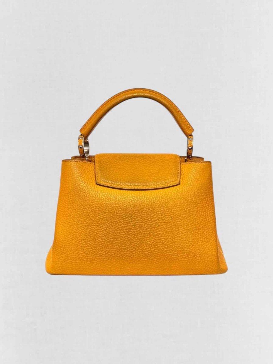Pre - loved LOUIS VUITTON CAPUCINES Mustard Top Handle at Reems Closet