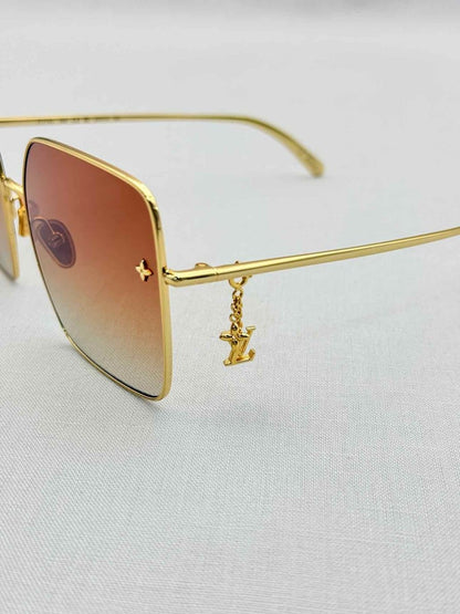 Pre-loved LOUIS VUITTON Gold Sunglasses at Reems Closet