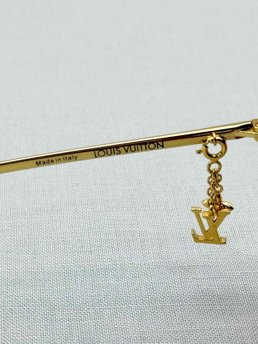 Pre-loved LOUIS VUITTON Gold Sunglasses at Reems Closet