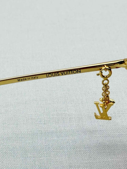 Pre-loved LOUIS VUITTON Gold Sunglasses at Reems Closet