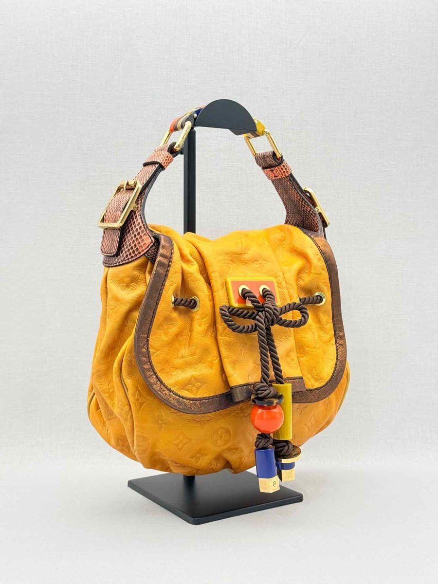 Pre - loved LOUIS VUITTON Kalahari Mustard Hobo bag at Reems Closet