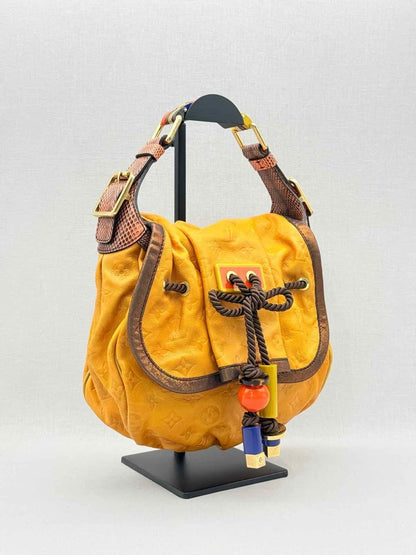 Pre - loved LOUIS VUITTON Kalahari Mustard Hobo bag at Reems Closet
