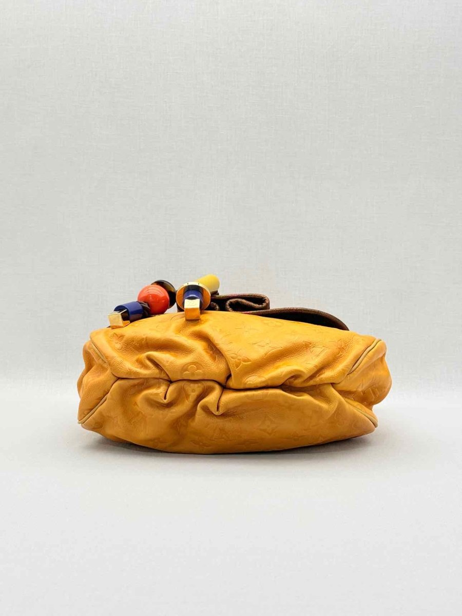 Pre - loved LOUIS VUITTON Kalahari Mustard Hobo bag at Reems Closet
