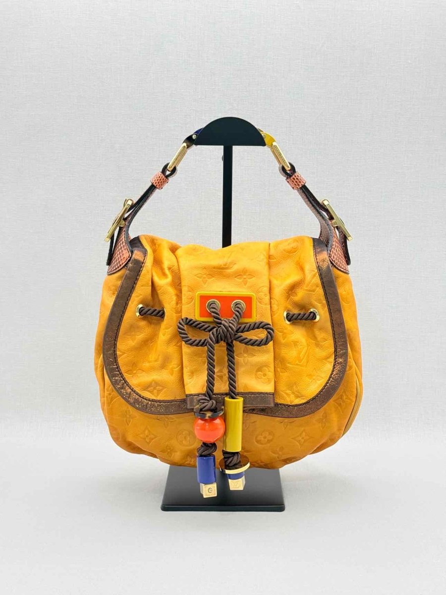 Pre - loved LOUIS VUITTON Kalahari Mustard Hobo bag at Reems Closet