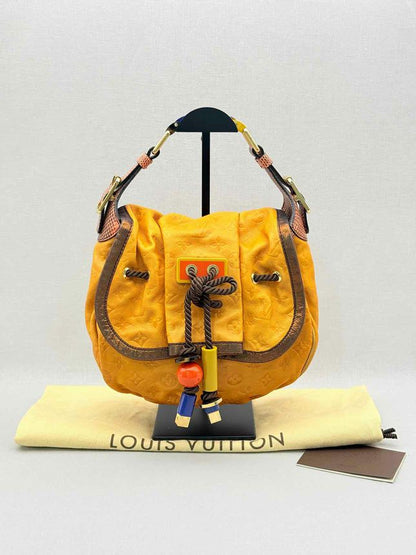 Pre - loved LOUIS VUITTON Kalahari Mustard Hobo bag at Reems Closet