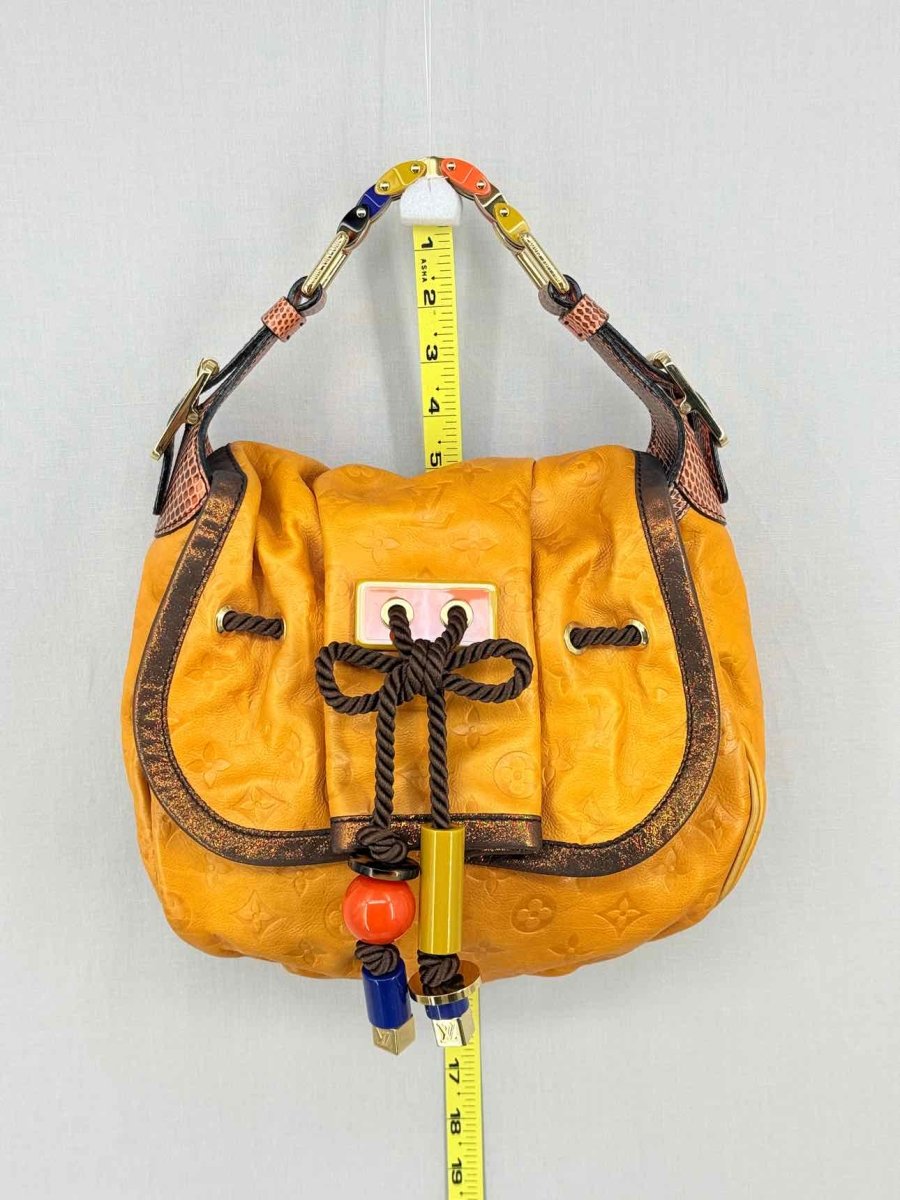 Pre - loved LOUIS VUITTON Kalahari Mustard Hobo bag at Reems Closet