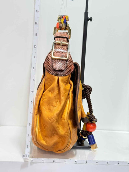 Pre - loved LOUIS VUITTON Kalahari Mustard Hobo bag at Reems Closet
