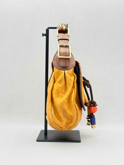 Pre - loved LOUIS VUITTON Kalahari Mustard Hobo bag at Reems Closet