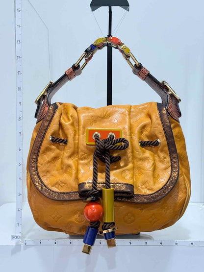 Pre - loved LOUIS VUITTON Kalahari Mustard Hobo bag at Reems Closet