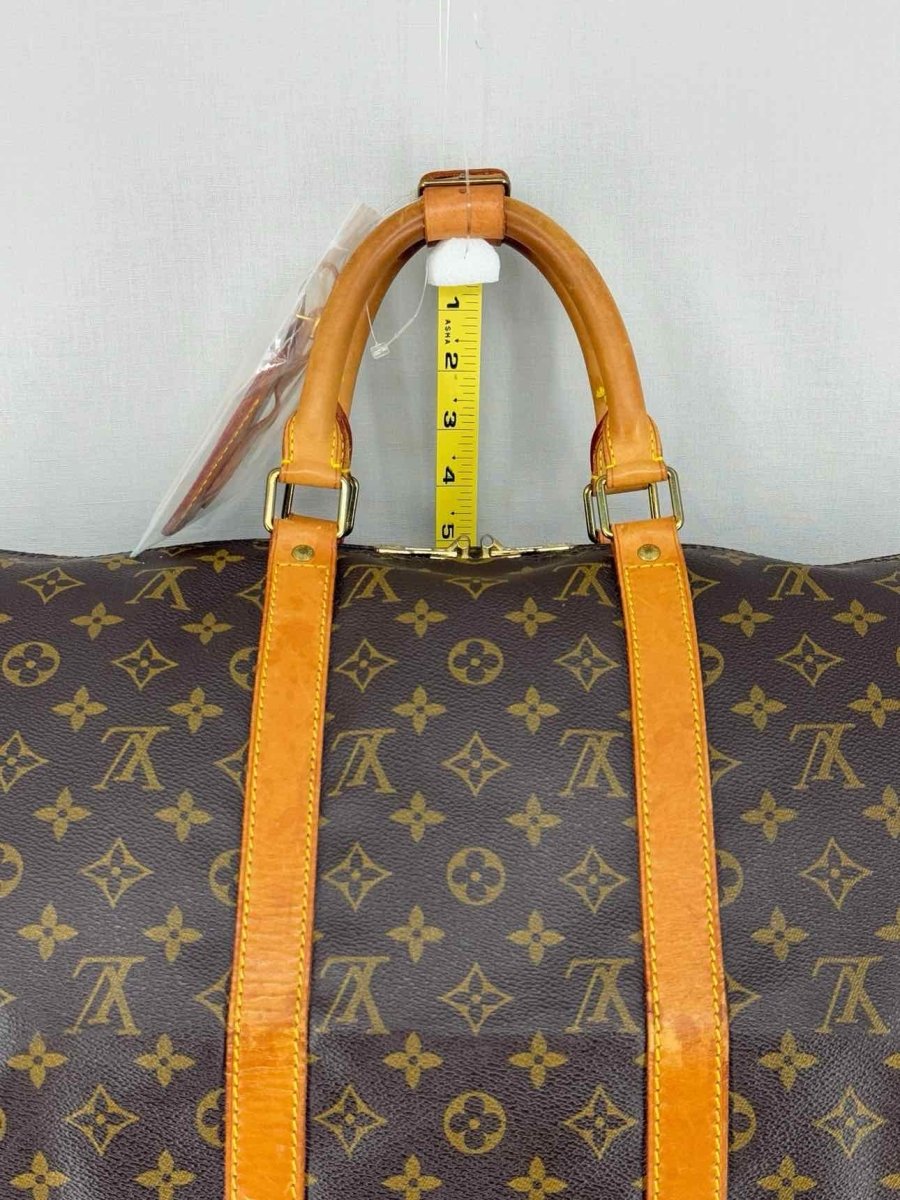 Pre - loved LOUIS VUITTON Keepall Brown Monogram Duffel bag at Reems Closet