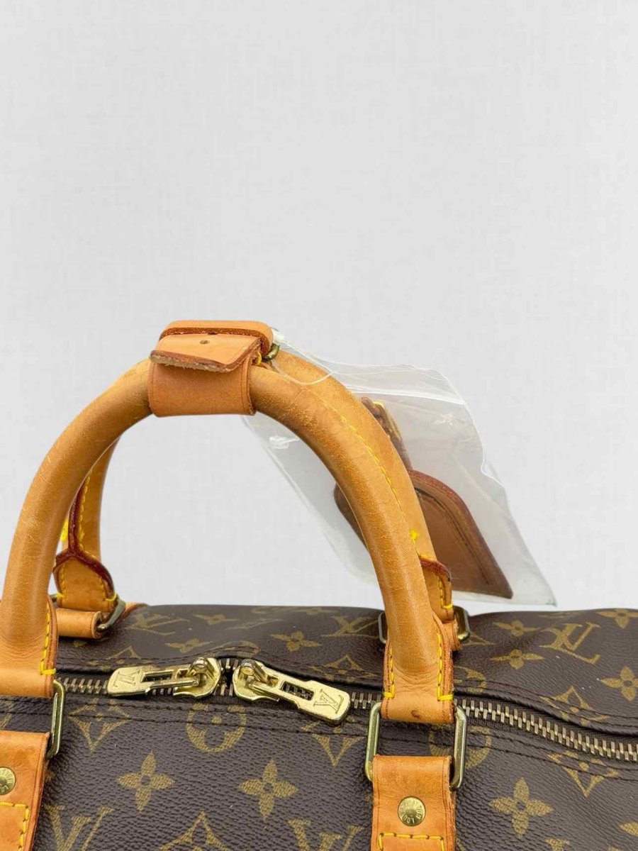 Pre - loved LOUIS VUITTON Keepall Brown Monogram Duffel bag at Reems Closet