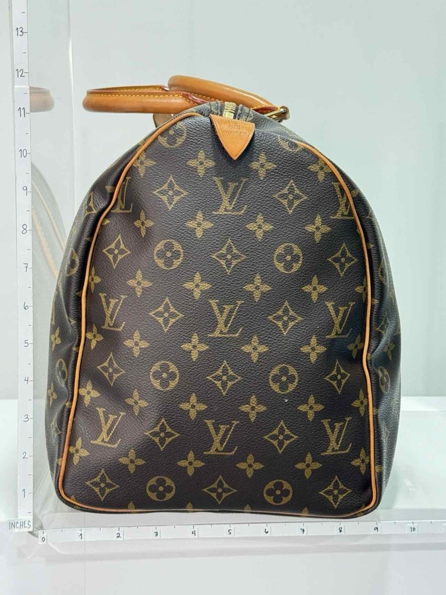 Pre - loved LOUIS VUITTON Keepall Brown Monogram Duffel bag at Reems Closet