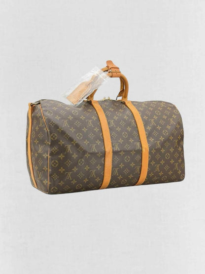 Pre - loved LOUIS VUITTON Keepall Brown Monogram Duffel bag at Reems Closet