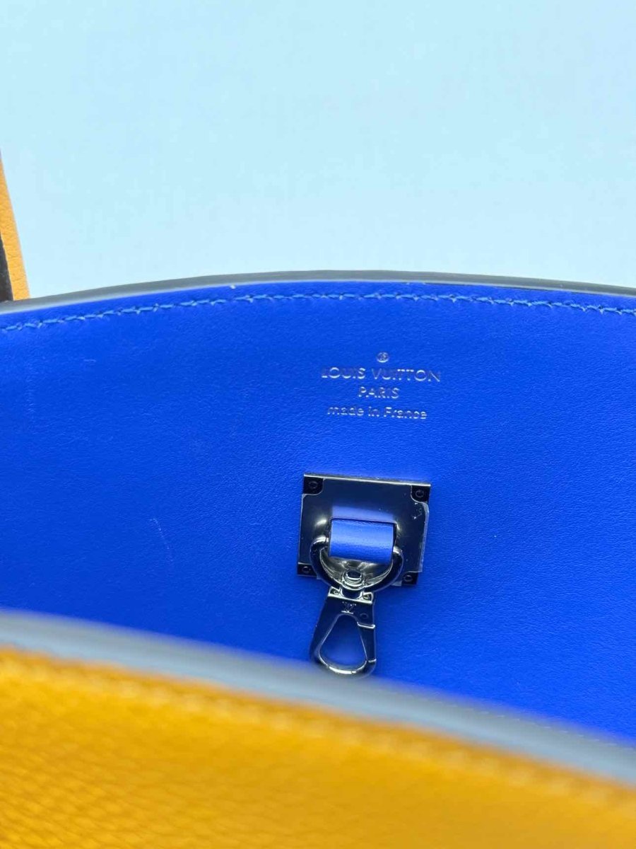 Pre - loved LOUIS VUITTON Mila Orange Tote Bag at Reems Closet