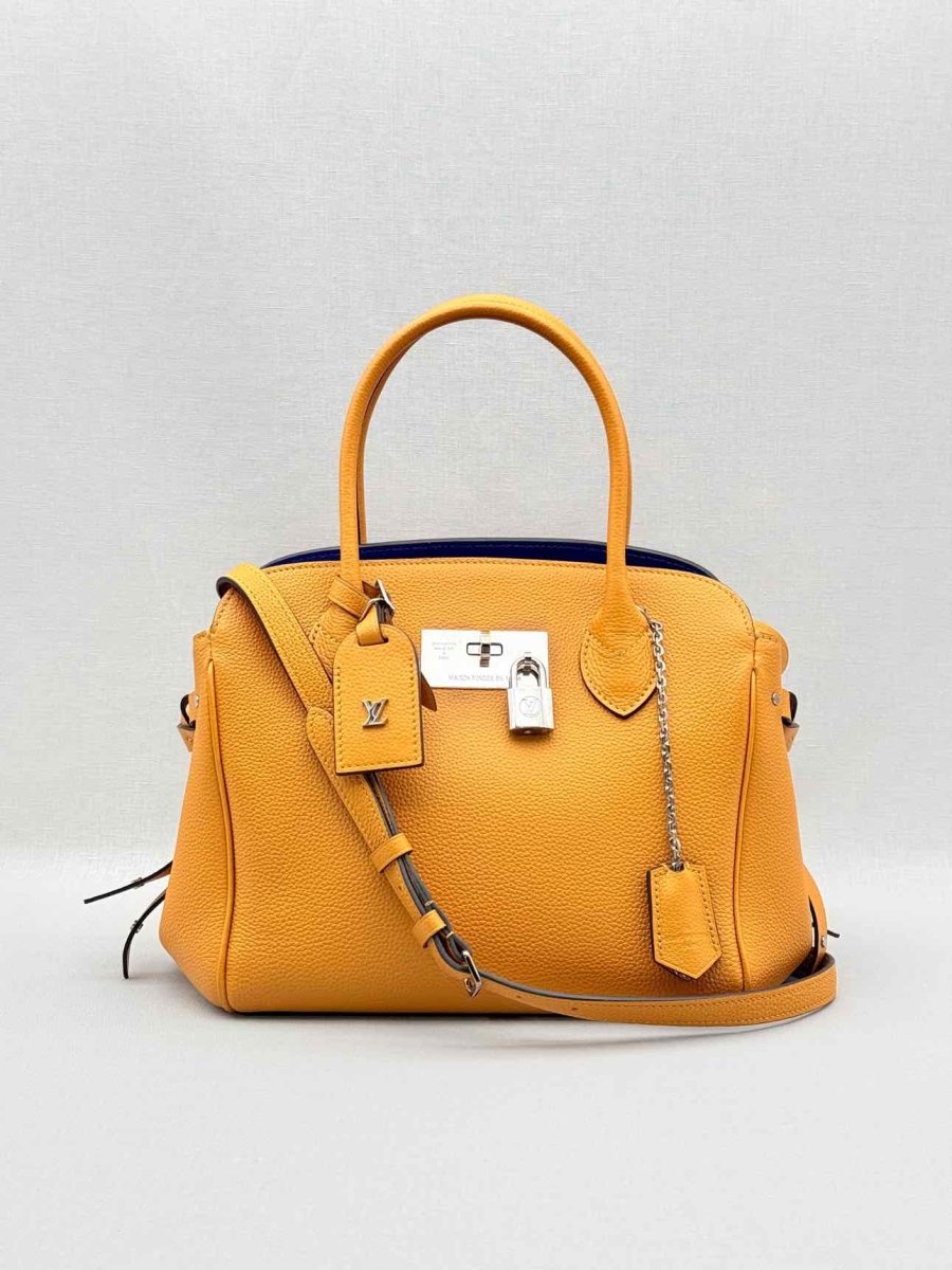 Pre - loved LOUIS VUITTON Mila Orange Tote Bag at Reems Closet