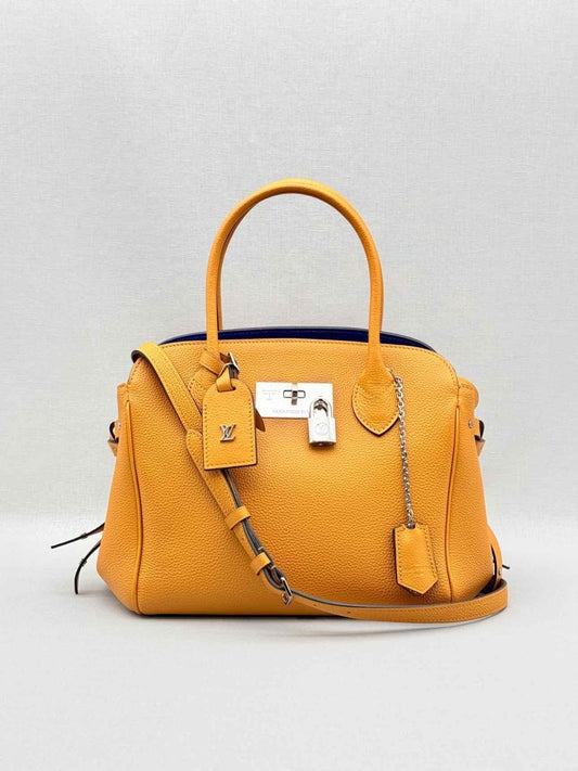 Pre - loved LOUIS VUITTON Mila Orange Tote Bag at Reems Closet