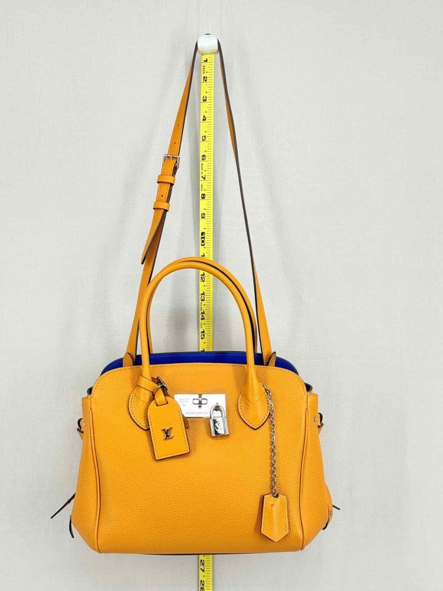 Pre - loved LOUIS VUITTON Mila Orange Tote Bag at Reems Closet