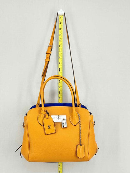 Pre - loved LOUIS VUITTON Mila Orange Tote Bag at Reems Closet