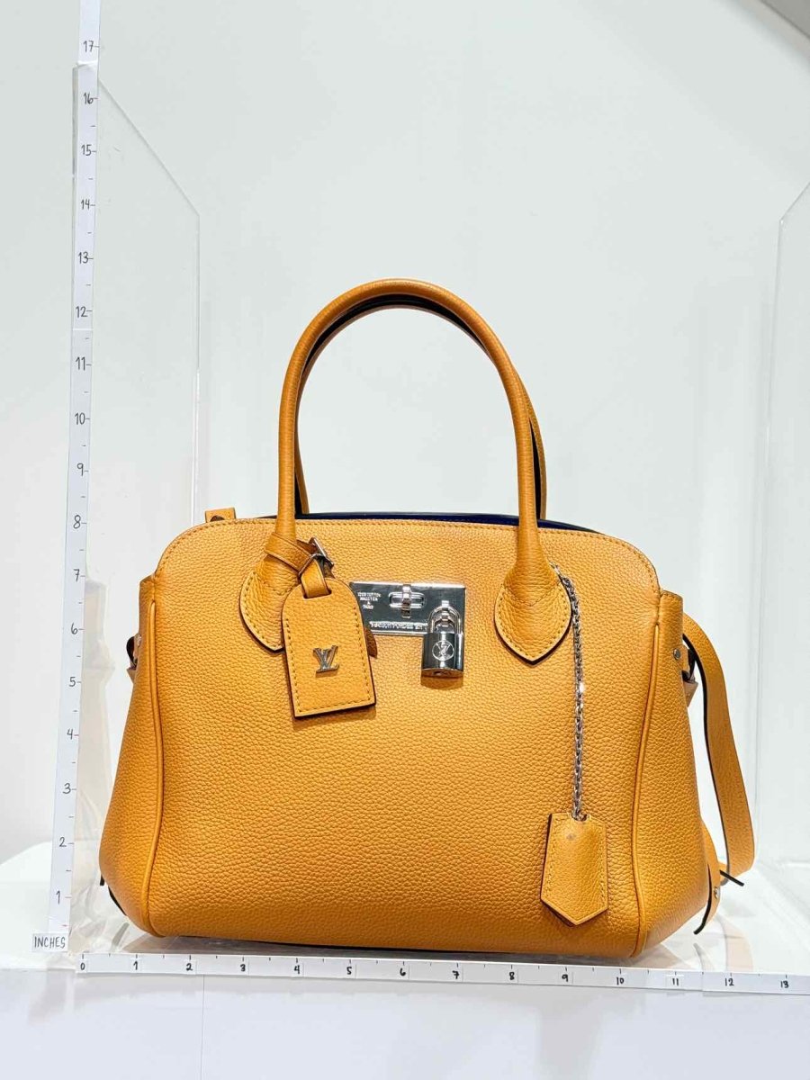 Pre - loved LOUIS VUITTON Mila Orange Tote Bag at Reems Closet