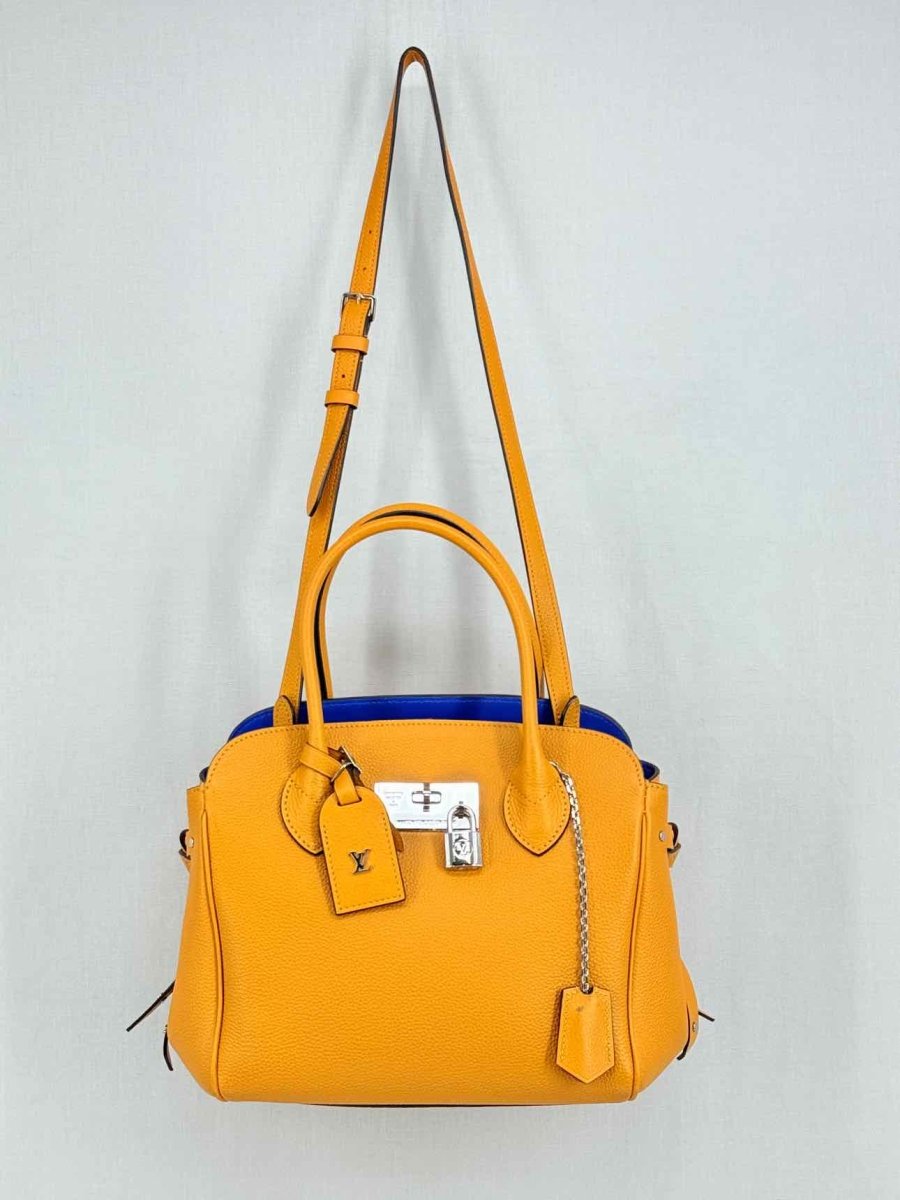 Pre - loved LOUIS VUITTON Mila Orange Tote Bag at Reems Closet