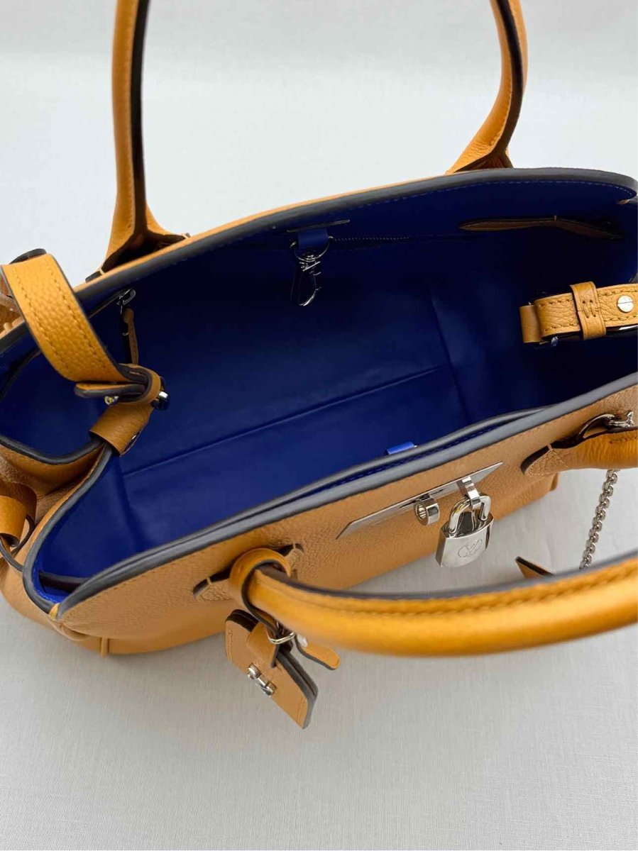 Pre - loved LOUIS VUITTON Mila Orange Tote Bag at Reems Closet