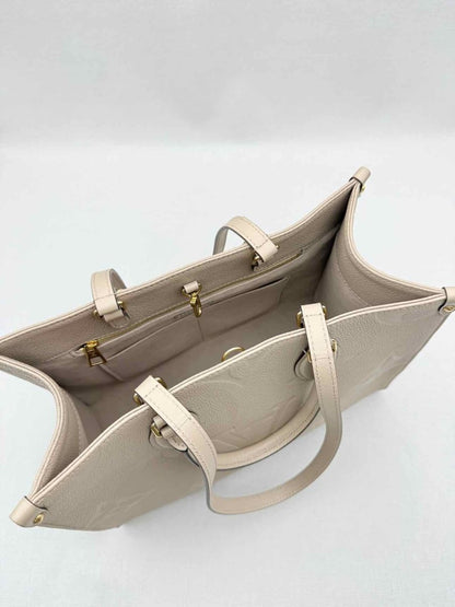 Pre-loved LOUIS VUITTON Onthego Cream Monogram Empriente Tote Bag at Reems Closet