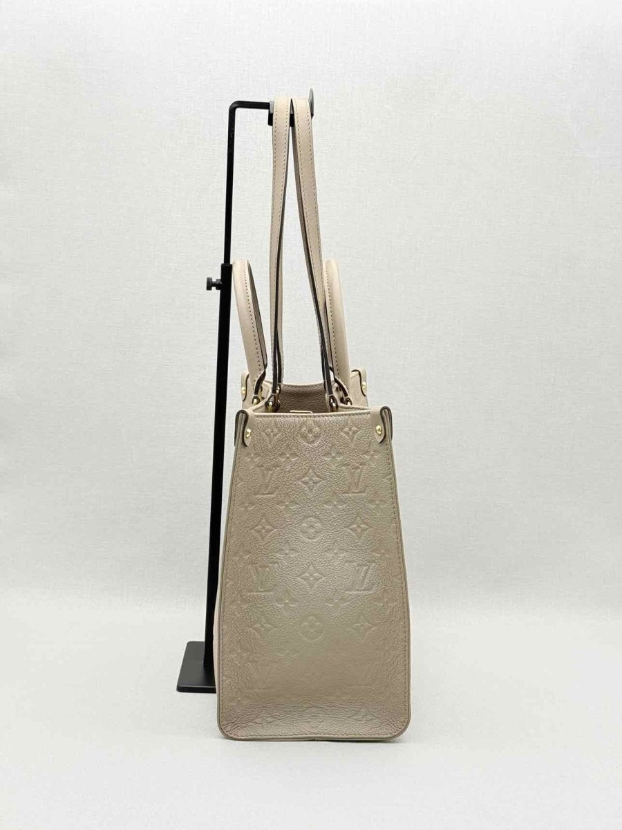 Pre-loved LOUIS VUITTON Onthego Cream Monogram Empriente Tote Bag at Reems Closet