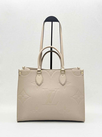 Pre-loved LOUIS VUITTON Onthego Cream Monogram Empriente Tote Bag at Reems Closet