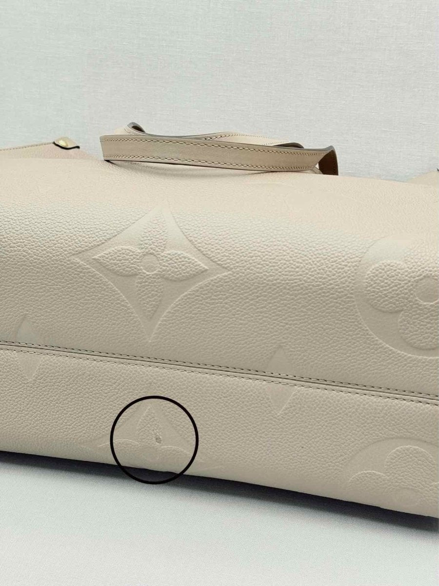 Pre-loved LOUIS VUITTON Onthego Cream Monogram Empriente Tote Bag at Reems Closet