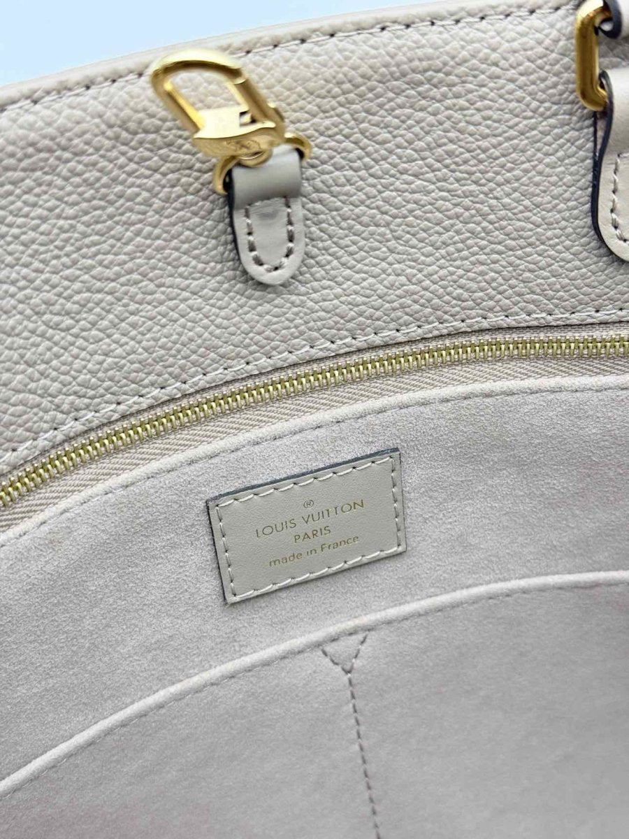 Pre-loved LOUIS VUITTON Onthego Cream Monogram Empriente Tote Bag at Reems Closet