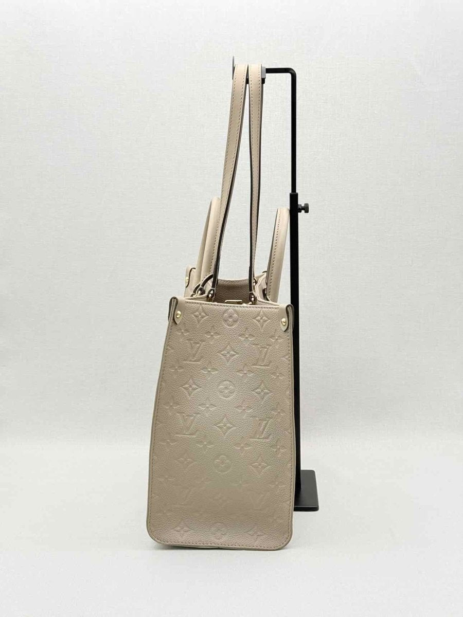 Pre-loved LOUIS VUITTON Onthego Cream Monogram Empriente Tote Bag at Reems Closet