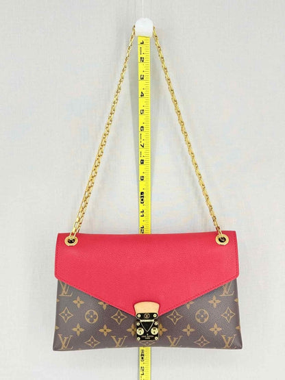 Pre-loved LOUIS VUITTON Pallas Chain Red Monogram Shoulder Bag at Reems Closet