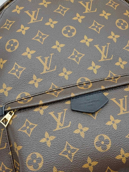 Pre - loved LOUIS VUITTON Palm Springs Brown Monogram Backpack at Reems Closet