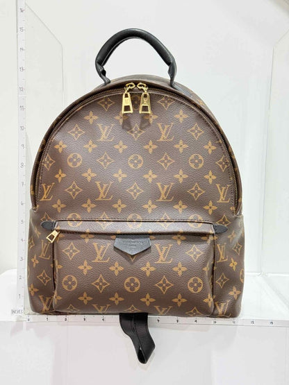 Pre - loved LOUIS VUITTON Palm Springs Brown Monogram Backpack at Reems Closet