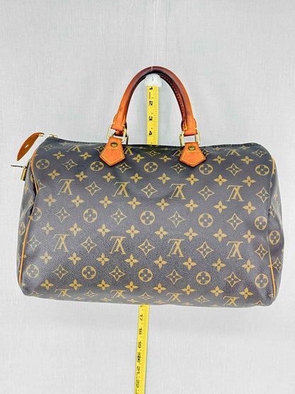 Pre - loved LOUIS VUITTON Speedy 30 Brown Monogram Top Handle at Reems Closet