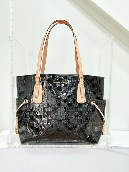 Pre - loved MICHAEL KORS Voyager Black Logo Embossed Tote Bag at Reems Closet