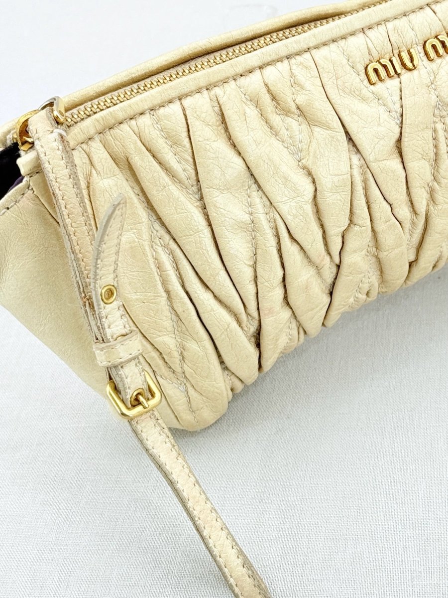 Pre - loved MIU MIU Cream Clutch at Reems Closet