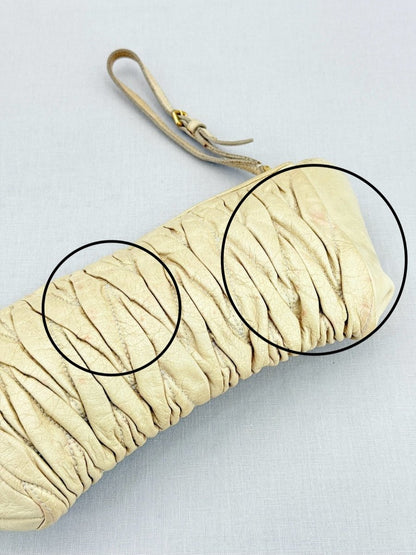 Pre - loved MIU MIU Cream Clutch at Reems Closet