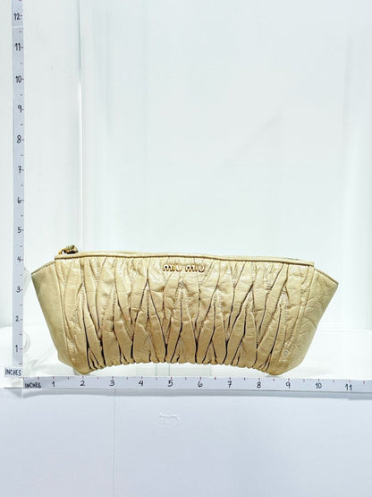 Pre - loved MIU MIU Cream Clutch at Reems Closet