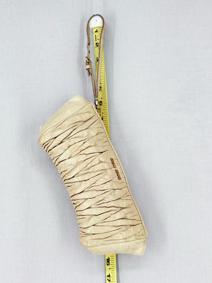 Pre - loved MIU MIU Cream Clutch at Reems Closet