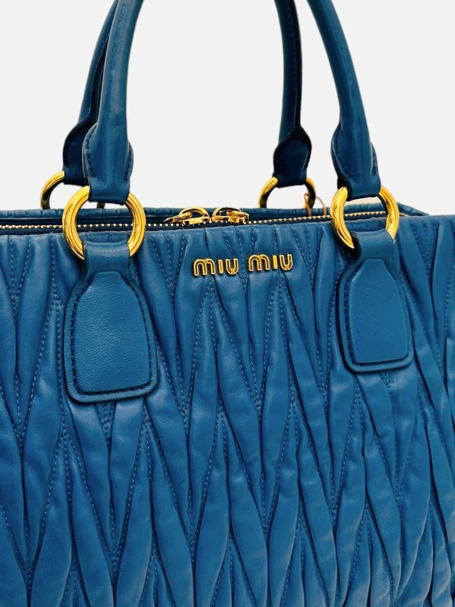 Pre - loved MIU MIU Matelasse Blue Top Handle at Reems Closet