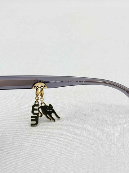 Pre - loved MIU MIU Purple Sunglasses at Reems Closet